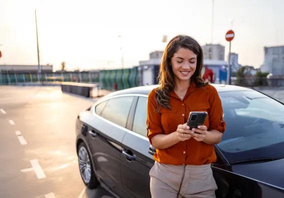 Woman using keyless app for unmanned car rental 