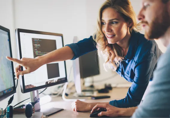 woman pointing at computer