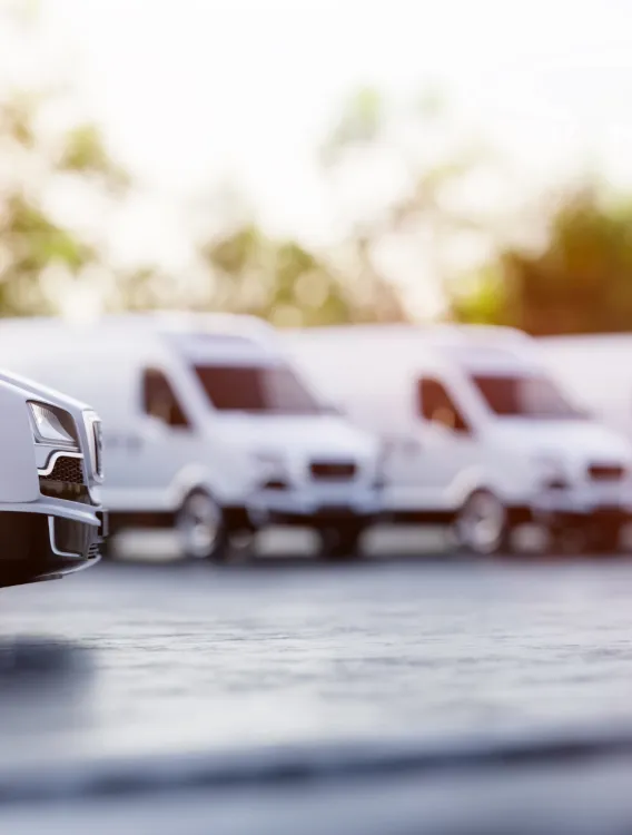 Rental vans lined up in parking lot