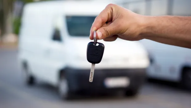 Presenting car key for rental van