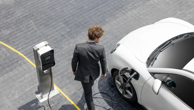 man at charging station