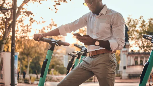 Man renting electric step via app