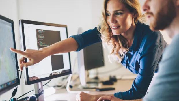 woman pointing at computer